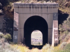 It's a short tunnel but its perfect for a model railroad. The portal says it was built in 1923.I believe the tunnel was constructed some 35 years after the railroad first arrived due to a more favorable alignment of trackage for the town of Ft. Benton.
