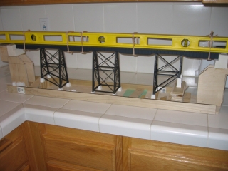 The bridge span is glued into position with the tower legs essentially unsupported.