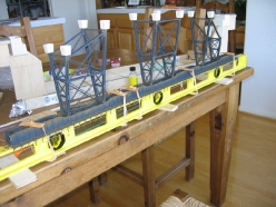 The trestle towers are glued to the inverted girder and track assembly.