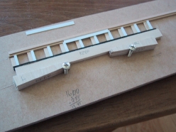 This jig is used to hold the bridge tie extensions in position while the walkway board are glued.